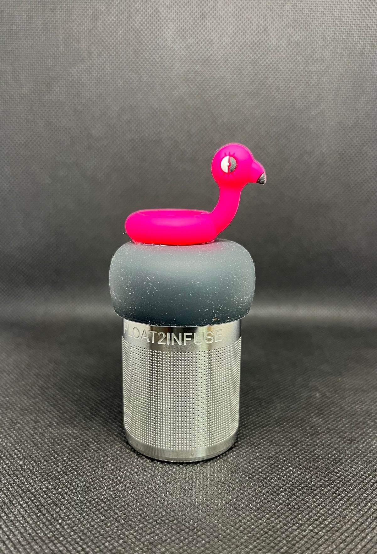 Flamingo floatie floating tea steeper with grey base