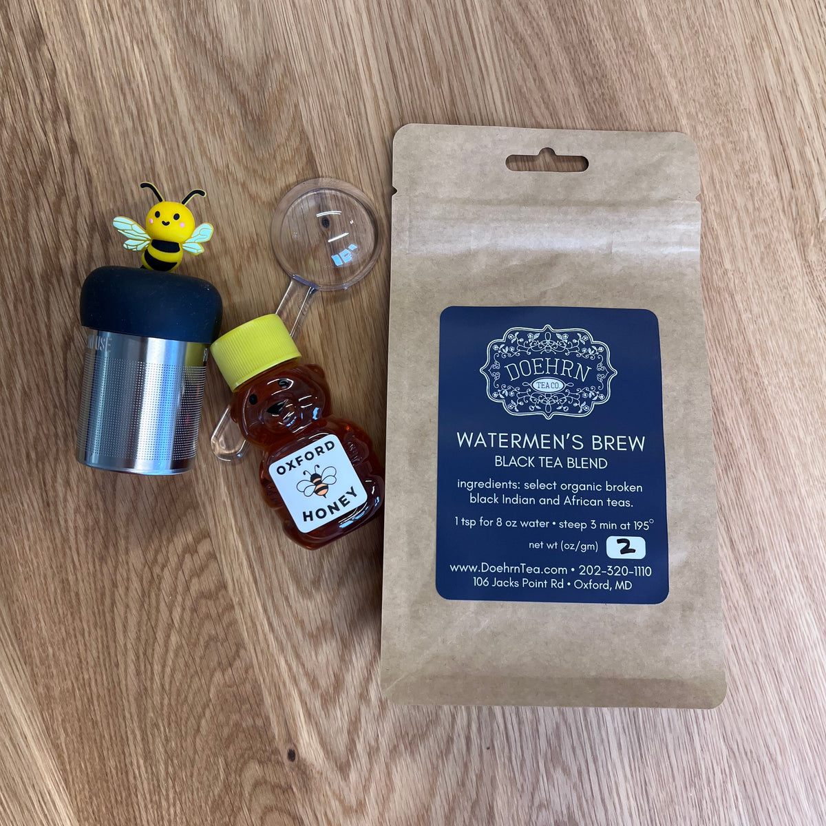 The Proper Cup Gift Set: bumble bee floating tea steeper, Watermen's Brew loose leaf tea, Oxford Honey Bear and tea scoop