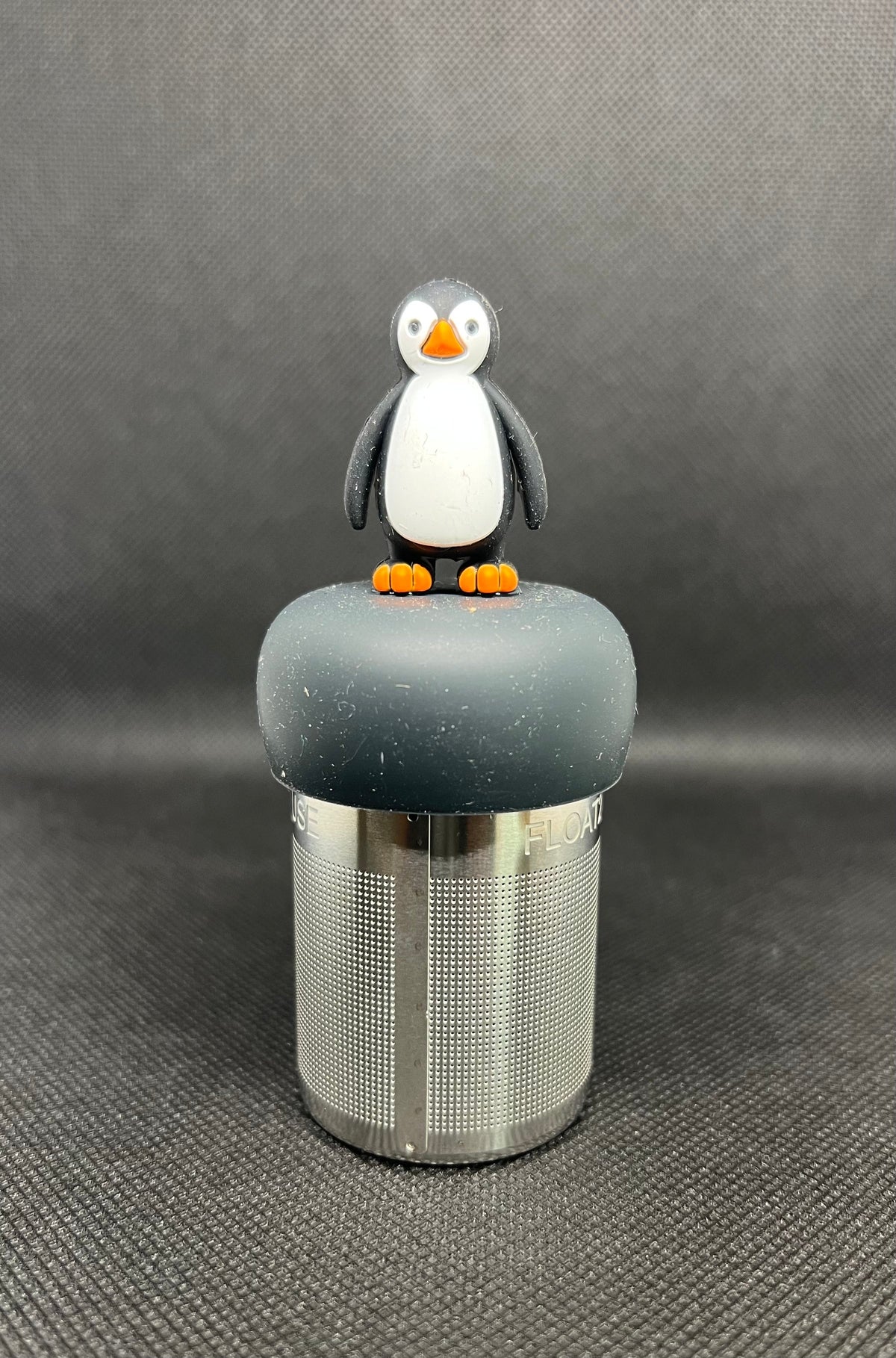 Penguin floating tea steeper with black base