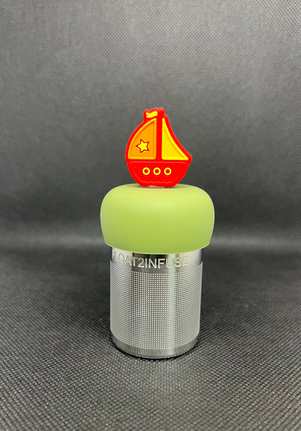 Sailboat floating tea steeper with green base
