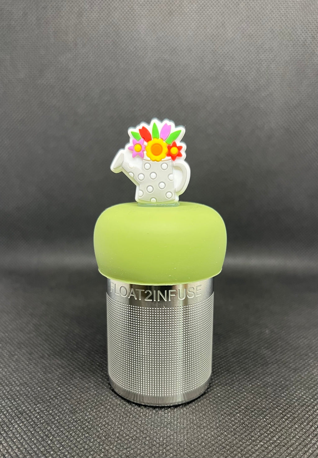 Floral watering can floating tea steeper with green base